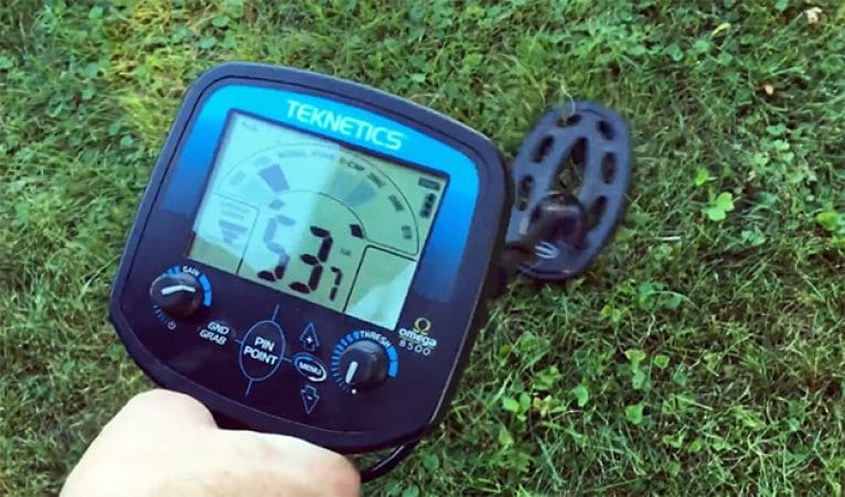 metal detecting in the backyard